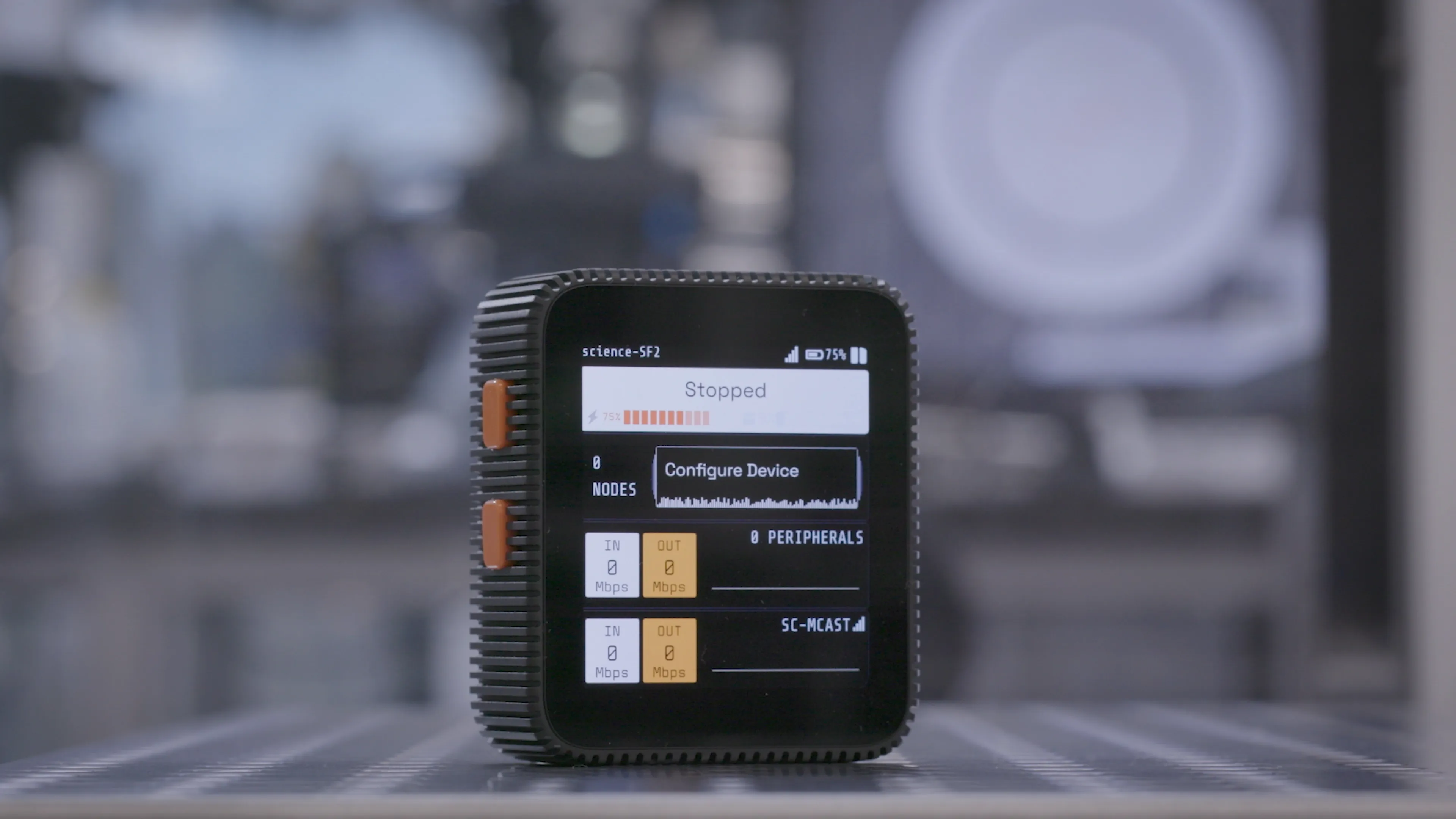 "The SciFi 2 headstage resting on a lab bench"